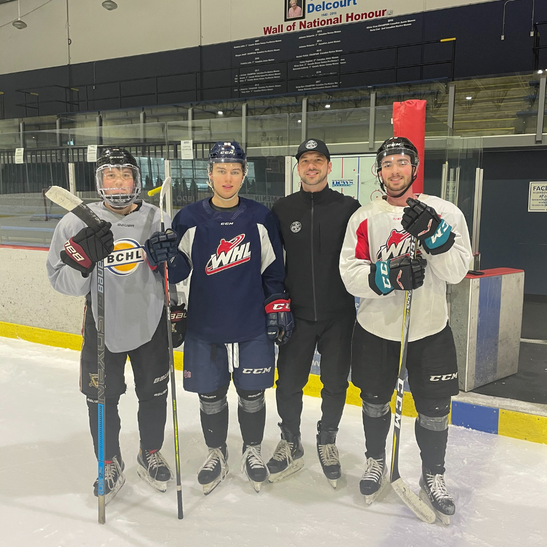 Aaron Konecsni on the ice with junior players